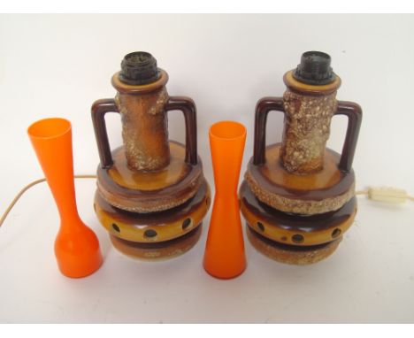 A pair of West German lava pottery lamp base and a pair of orange glass vases (4). 