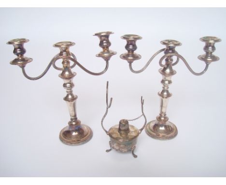 A pair of old Sheffield plate three light candelabra and a silver plated brandy glass warmer.