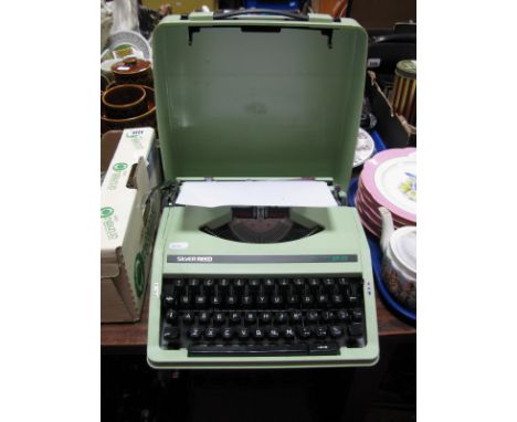 A 1970's Silver Reed SR22 Portable Typewriter, in a mint green colour, black keys.