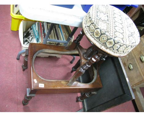 An Early XX Century Walnut Piano Stool, with upholsted top, on turned supports, shaped feet, (damaged), together with an oak 