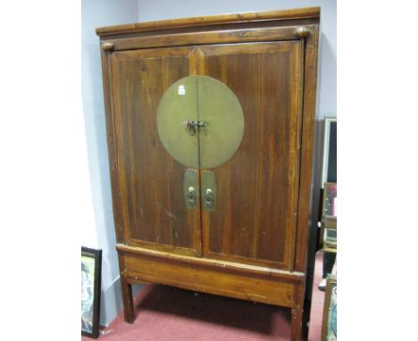 A Chinese Painted Softwood Cabinet, with twin drawers over shelf, brass bar to circular lock plate, on black legs, 109cm wide