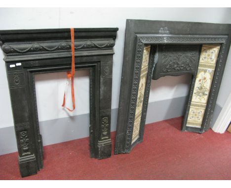 A Circa 1900 Style Cast Iron Fire Surround, inset with twin ceramic strips and a cast iron bedroom fire surround. (2)