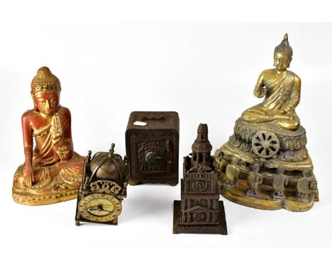 A cast metal figure of a seated Buddha with five kneeling onlookers, a gilt-heightened wooden seated Buddha, a cast metal pag