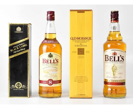 Four bottles of whisky comprising two Bell's Extra Special 1L, Bell's Blended Scotch 1L, a boxed Johnnie Walker Black Label 7
