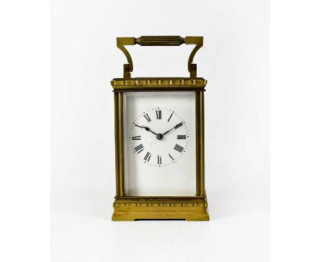 A brass-cased carriage clock, the enamel dial set with Roman numerals, movement striking on a coil, height 12.5cm.Condition R