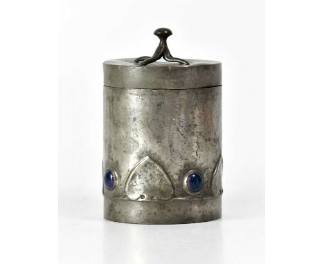 A Tudric-style pewter lidded jar, set with four Ruskin-style ceramic glazed cabochons interspersed with heart-shaped leaves, 