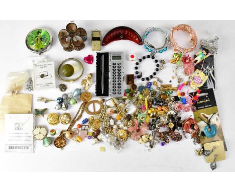 A quantity of costume jewellery, to include earrings, single clip-on earrings, bracelets, dress clips, etc, also beads, tie c
