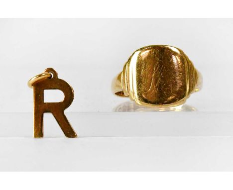 A 9ct yellow gold signet ring with vacant table, inscribed verso 'HDS to VS 15/1/41', size M, and a 9ct yellow gold 'R' penda