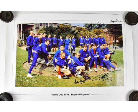 WORLD CUP 1966; a colour photograph of the 1966 England World Cup team, signed by Martin Peters, Roger Hunt, George Cohen, et