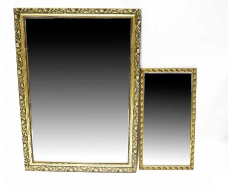 A rectangular gilt framed wall mirror with moulded floral border, 102 x 70cm, together with a smaller similar mirror and a fr