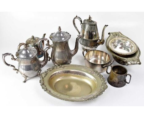 A large quantity of silver plated wares comprising teapot, coffee pot, salvers, saucers, sauceboats, covered tureens, candles