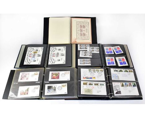 Seven albums of predominantly first day covers, dating from the 1960s-70s, including British, American, European, and commonw