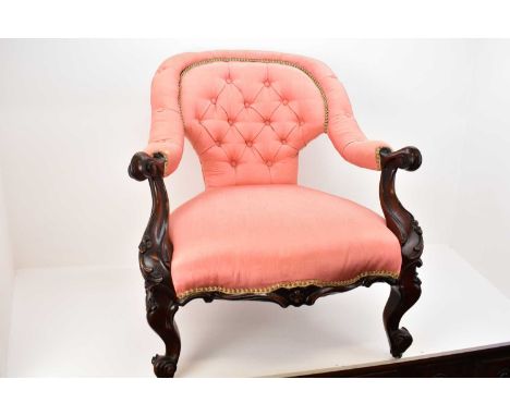 A 19th century walnut salon chair with upholstered button back, side and top rail, upholstered seat, carved front supports, r