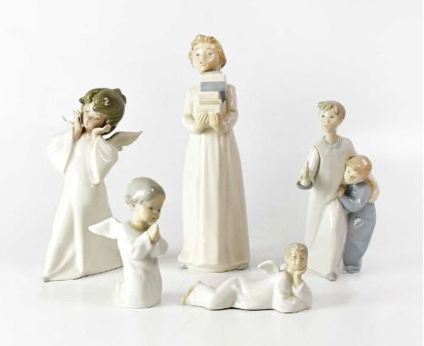 LLADRÓ; four figures, comprising three angels and a figure group of two boys with a chamber stick, together with a Nao figure