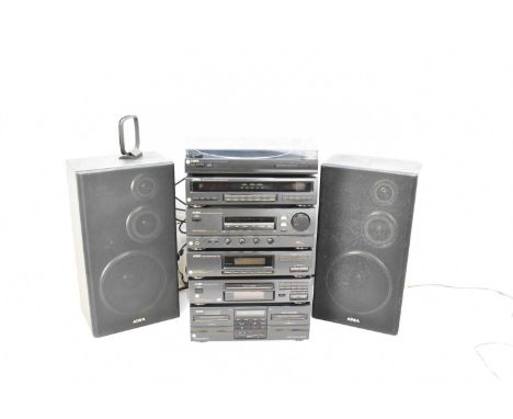An AIWA music tower system comprising stereo full automatic turntable system PX-E80, graphic equalizer/spectrum analizer GE-Z