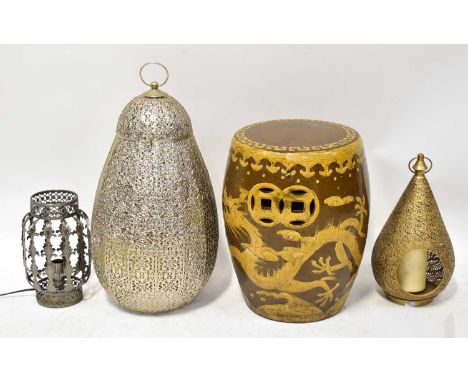 Three pierced metal lanterns of various designs, together with a Chinese ceramic garden seat, decorated with dragons, height 