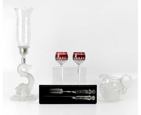 A collection of glassware comprising a Baccarat glass hurricane lamp, with etched shade and dolphin support, on a domed circu