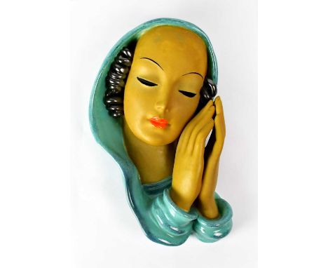 GOLDSCHEIDER; a ceramic wall plaque in the form of a head and shoulders portrait of a lady, with hands together as if praying