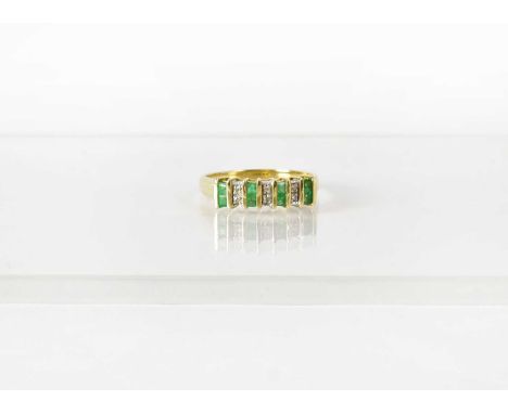 A 9ct yellow gold ring set with alternating pairs of emeralds and diamonds, size R, approx. 3.2g.Condition Report: - Stamped 