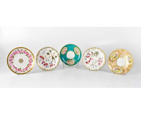 A collection of five 19th century porcelain saucers, including one painted with a border of pink roses with gilt rim, diamete