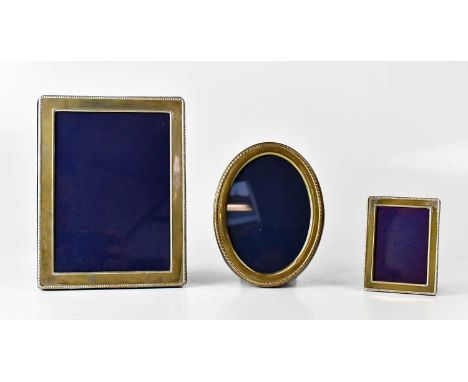 KITNEY &amp; CO; a rectangular hallmarked silver photograph frame with beaded edge, aperture 17.6 x 12.6cm, a smaller matchin