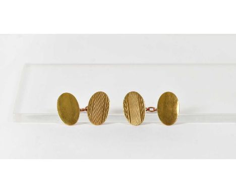 A pair of 9ct yellow gold oval cufflinks with engine turned decoration, combined approx. 3.7g.Condition Report: - Each stampe