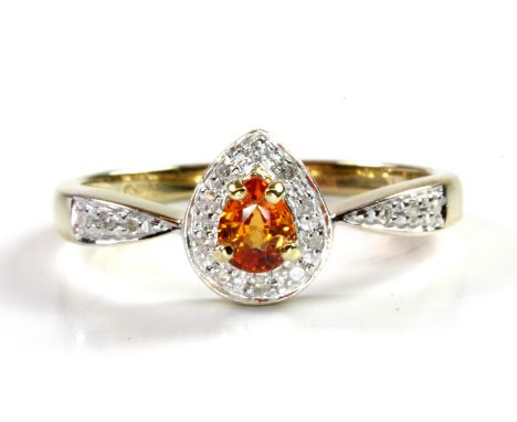 A 9ct yellow gold cluster ring set with an orange sapphire and diamonds, (M.5).