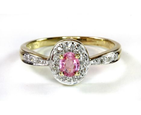 A 9ct yellow gold cluster ring set with pink sapphire and diamonds, (P.5).