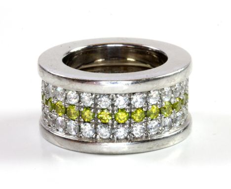 A very heavy gentleman's white metal (tested 18ct gold) ring set with three rows of yellow and white brilliant cut diamonds, 