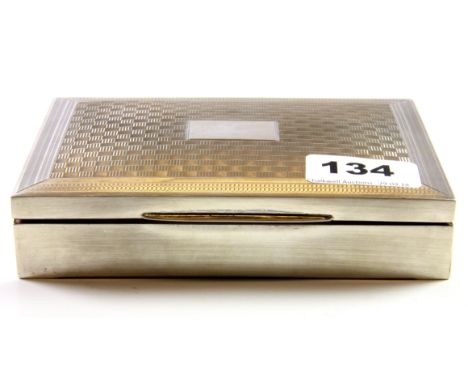 A hallmarked silver cigarette box with Art Deco engine turned design top, 14.5 x 10 x 3cm.