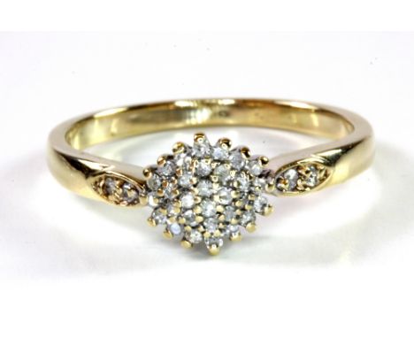 A 9ct yellow gold diamond set cluster ring, (R.5).