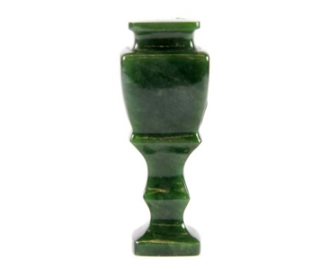 A carved apple green jade seal, H. 8cm.