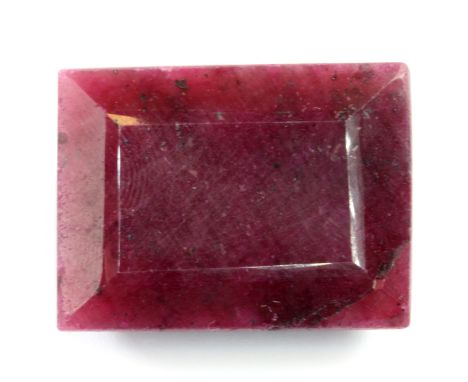 An unmounted 87.5ct baguette cut ruby, 2.8 x 2cm.