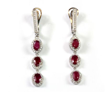 A pair of 925 silver ruby and white stone set drop earrings, L. 5cm.