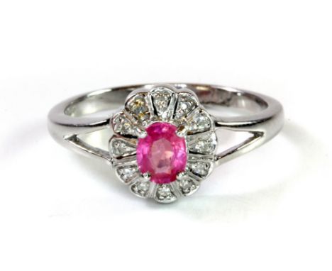 A 9ct white gold pink sapphire and diamond set cluster ring, (M.5).