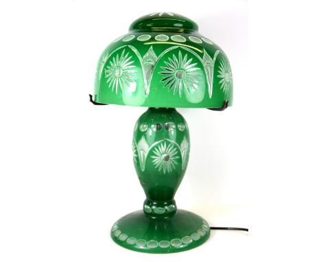 A Bohemian green glass table lamp and shade, H. 50cm.