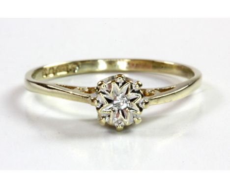 A 9ct yellow gold diamond set solitaire ring, (I.5).