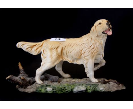 A Doulton/Beswick ceramic model of a retriever (model no. 3066), L. 29cm.