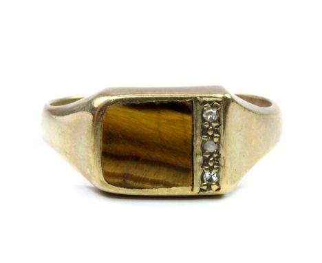 A gentleman's 9ct yellow gold (worn mark) tiger's eye and diamond set signet ring, (W).