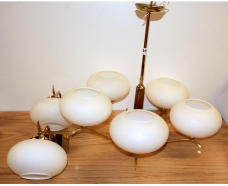 A five branch gilt brass light fitting and two wall lights.