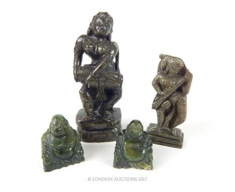 Two carved stone Hindu goddesses, each playing a musical instruments, 13.5cm & 9.5cm, together with two small Chinese carved 