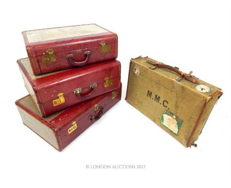 A set of three canvas Airess suitcases each with red leather mounts, embossed with initials J. M. T., together with a canvas 