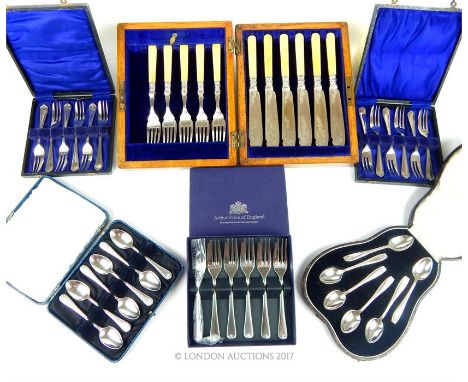 A collection of cased silver plated flatware, including a pair of cases of cake forks, two cases of tea spoons, an oak cantee