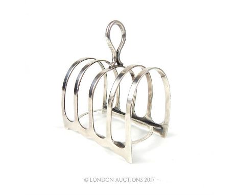 A George V hallmarked silver four division toast rack, Harrison Brothers & Howson, Sheffield 1927, weighs 2.57 toz.