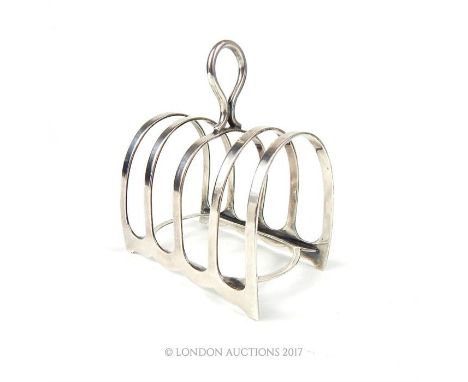 A George V hallmarked silver four division toast rack, Harrison Brothers & Howson, Sheffield 1927, weighs 2.57 toz.