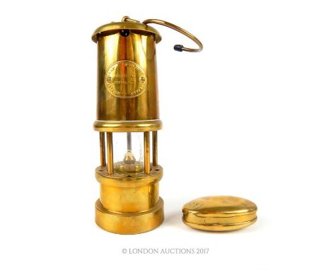 An oval Georgian brass snuff box, 6cm wide, together small brass miners lamp, bearing plaque for Hockley Lamp & Limelight Com