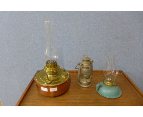 A Victorian copper and brass oil lamp and two others 