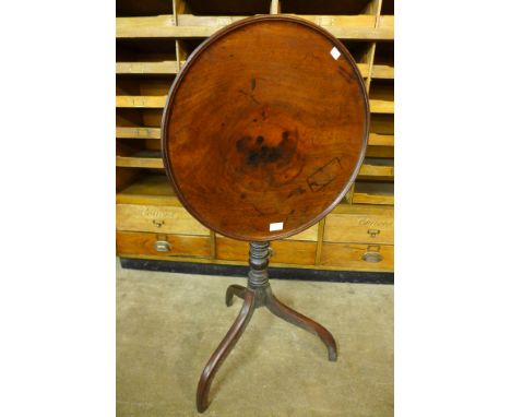 A George III mahogany circular tilt top tripod table 