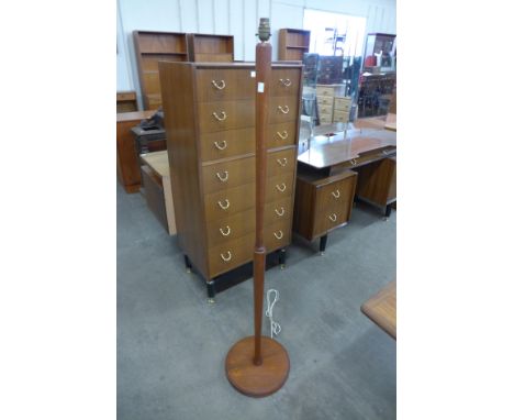 A teak standard lamp 