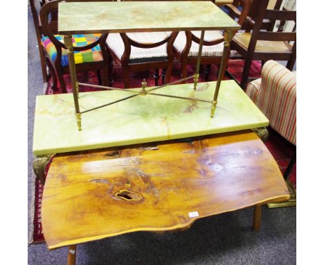 A coffee table made from a section of a tree trunk; an onyx effect coffee table with brass legs; an onyx effect and brass sid